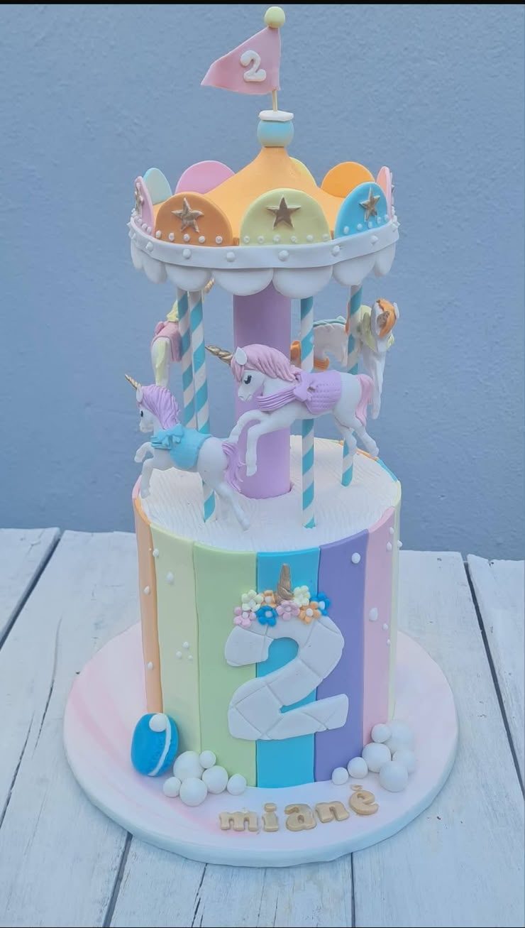 Pastel carousel first birthday cake